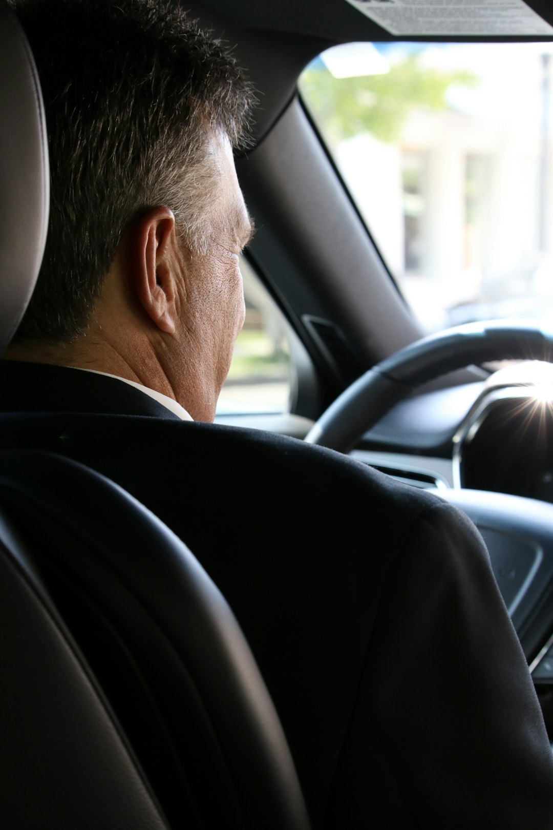 A professional driver behind the wheel of a car